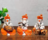 Karigaari India Polyresine Set of 3 Orange Dhoti & Turban Ganesha Playing Instruments Showpiece