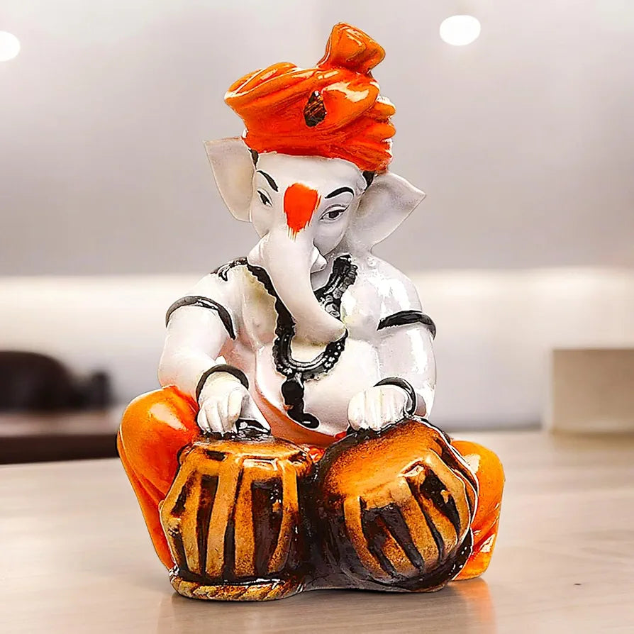 Karigaari India Polyresine Orange & White Ganesha Playing Tabla
