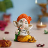 Ecraftindia Orange Polyresin Handcrafted Dancing Lord Ganesha Idol While Sitting | God Idol