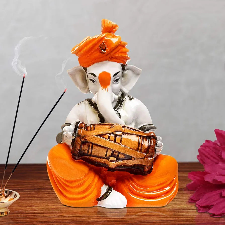 Karigaari India Karigaari Polyresine Orange & White Ganesha Playing Dholak