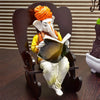 Karigaari India Ganesha Resting on Rocking Chair - Brown & White