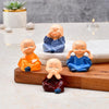 Collectible India Buddha Monk Set of 4 Statue Figurines Showpiece Cute Mini Idol for Car Dashboard